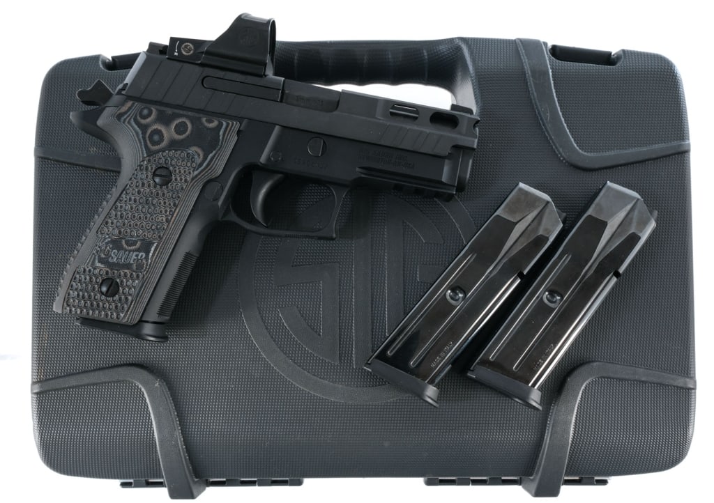 Sig Sauer P229 Pro 9mm Semi Auto Pistol: Sig Sauer P229 Pro chambered in 9mm with three, ten round magazines and a 3.9" carbon steel barrel. Beavertail alloy frame with G10 Piranha Mascus grips. Double/single action trigger. Picatinny access