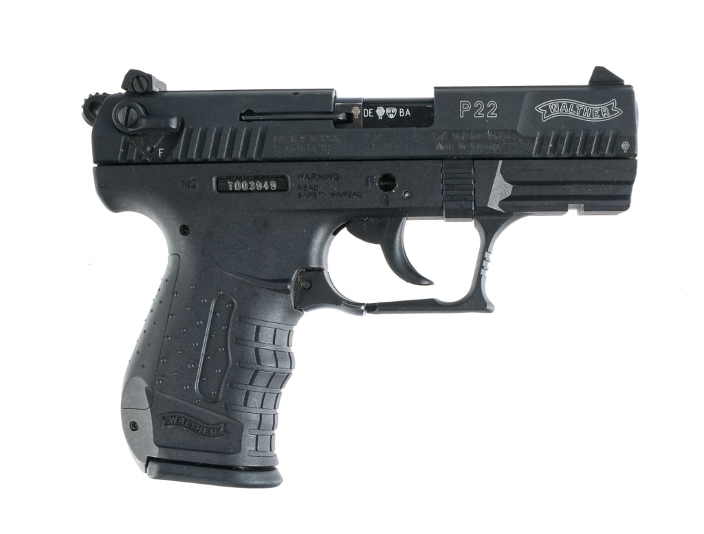 Walther P22 .22 LR Semi Auto Pistol: Walther Model P22 in .22 Long Rifle with one, ten round removable magazine and a 3.5" barrel. Black composite frame and trigger. Blued metal serrated slide and hammer. Trigger guard located ambidextro