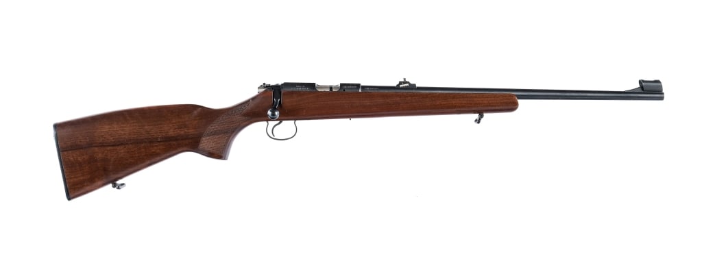 CZ 455 .22 Magnum Bolt Action Rifle: CZ 455 chambered in .22 Magnum with a 20.5" barrel. Adjustable rear Williams sight and hooded front blade. Grooved receiver for mounting optics. Rear safety lever. Wood checkered pistol grip stock. Fr