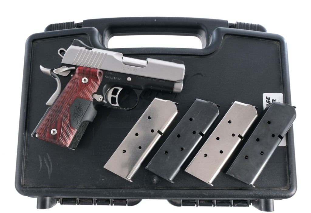 Kimber Ultra CDP II .45 ACP Semi Auto Pistol: Kimber Ultra CDP II in .45 ACP with five, seven round removable magazine and a 3.25" barrel. Checkered composite laser grip plates-needs battery. Two tone with a matte black colored finished frame and