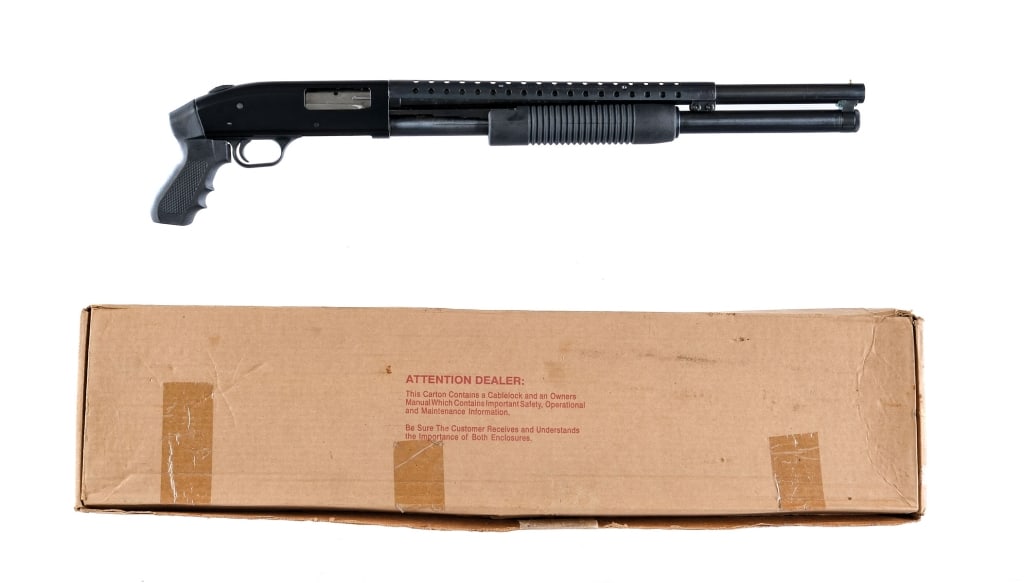 Mossberg 500A Persuader 12 Ga Pump Action shotgun: Description Mossberg 500A Persuader in 12 gauge for 2 3/4" and 3" shells with a seven round capacity and a 21" barrel. Blued barrel, magazine tube, heat shield, and trigger. Black finished anodized re