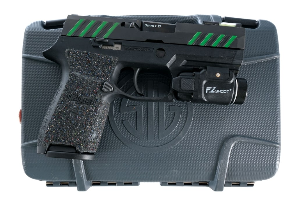 Sig Sauer P320C 9mm Semi Auto Pistol: Description Sig Sauer P320C chambered in 9mm with one, ten round magazine and a 3.9" barrel. Textured polymer frame with accessories rail and aftermarket grip tape. Mounted EZ Shoot light. Striker fir