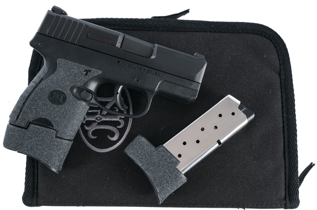 FN 503 9mm Semi Auto Pistol: Description Fabrique Nationale 503 chambered in 9mm with two, eight round magazines and a 3.1" barrel. Textured polymer thin frame with after market grip tape. Striker fired trigger with shoe safety.