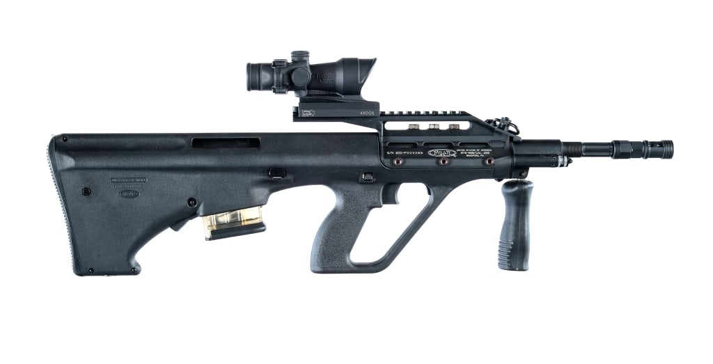 MSAR STG-556 5.56 Semi Auto Rifle: Description MICROTECH SMALL ARMS RESEARCH (MSAR) STG-556 chambered in 5.56x45mm NATO/.223 Remington with one, ten round AUG waffle magazine and a 16" barrel. Front flash suppressor. Folding vertical g