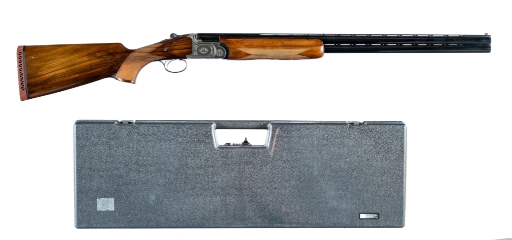 Employee Colt / Beretta 12 Ga 1 of 1 Shotgun: Description Colt / Dr. Franco Beretta over under shotgun in 12 gauge 2 3/4" with a two round capacity and a 29.5" top rib vented over under barrel. Made in Italy for Colt in 1995. This shotgun has