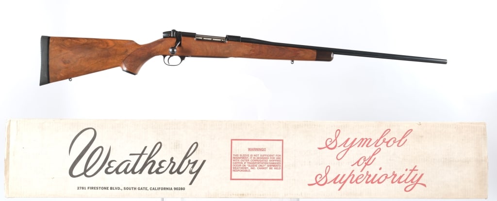 Weatherby Mark V 7mm Wby Mag Bolt Action Rifle: Description Weatherby Mark V chambered in 7mm Weatherby Magnum with a three plus one capacity and a 24" barrel. Drilled and tapped receiver. Bolt mounted safety. Blued finish with wood stock. Checkere