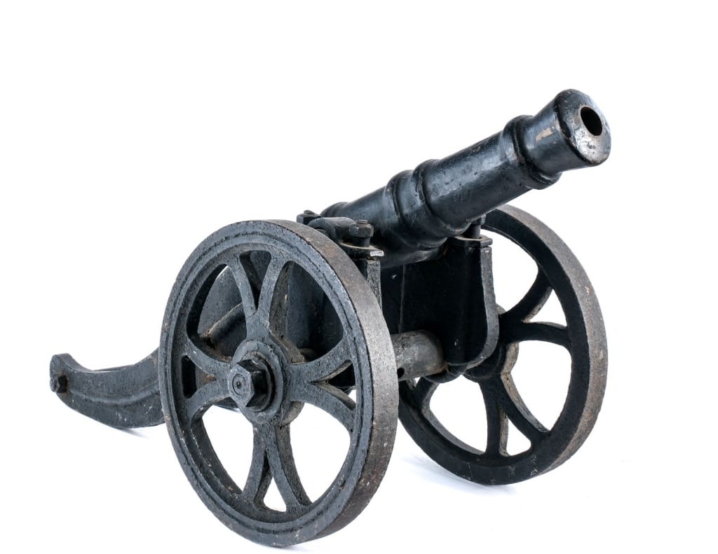 Antique Cast Iron Signal Cannon: Description Antique cast iron signal cannon measuring in at the bore 29mm with a 22" long barrel with priming vent/touch hole. Unknown and unmarked maker. Cast iron carriage, wheels and barrel. 33" fr