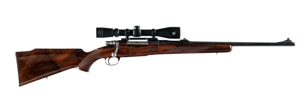 Browning Safari Grade .30-06 Bolt Action Rifle: Description Browning Safari Grade in .30-06 with a four round capacity and a 22.5" barrel. Checkered Monte Carlo style wood stock with composite butt plate. Blued trigger, receiver and barrel. The mag