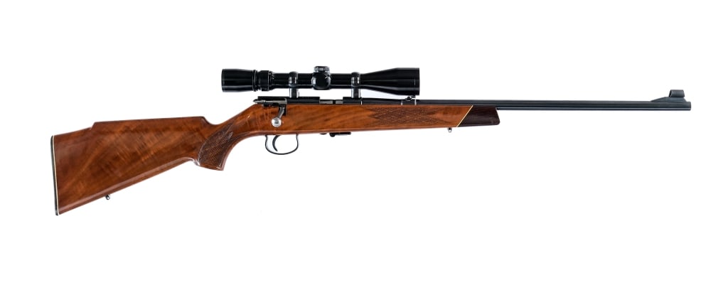Savage / Anschutz 141 .22 LR Bolt Action Rifle: Description Savage Anschutz Model 141M in .22 Long Rifle with one, five round removable magazine and a 22" barrel. Made in West Germany in 1965. One piece checkered Monte Carlo style wood stock with c
