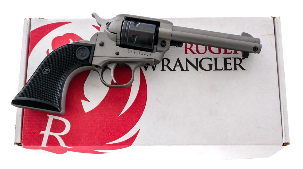 Ruger Wrangler .22 LR Single Action Revolver: Description Ruger Wrangler in .22 long rifle with a six round capacity and a 4.5" barrel. Made in Newport New Hampshire in 2020. Checkered black composite grip plates. Silver cerakote finished trigger