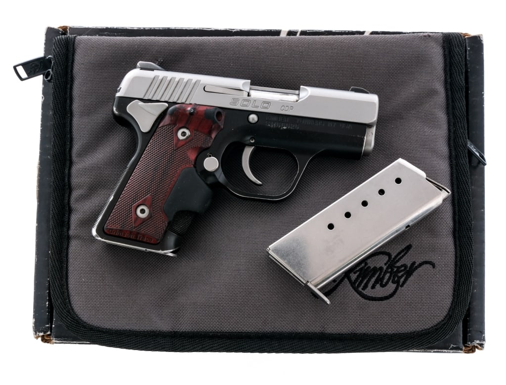 Kimber Custom Shop Solo CDP 9mm Pistol: Description Kimber Custom Shop Solo CDP in 9mm with two, six round removable magazines and a 3 3/4" barrel. Crimson Trace checkered wooden grip plates with working laser in the grip. Black anodized fr