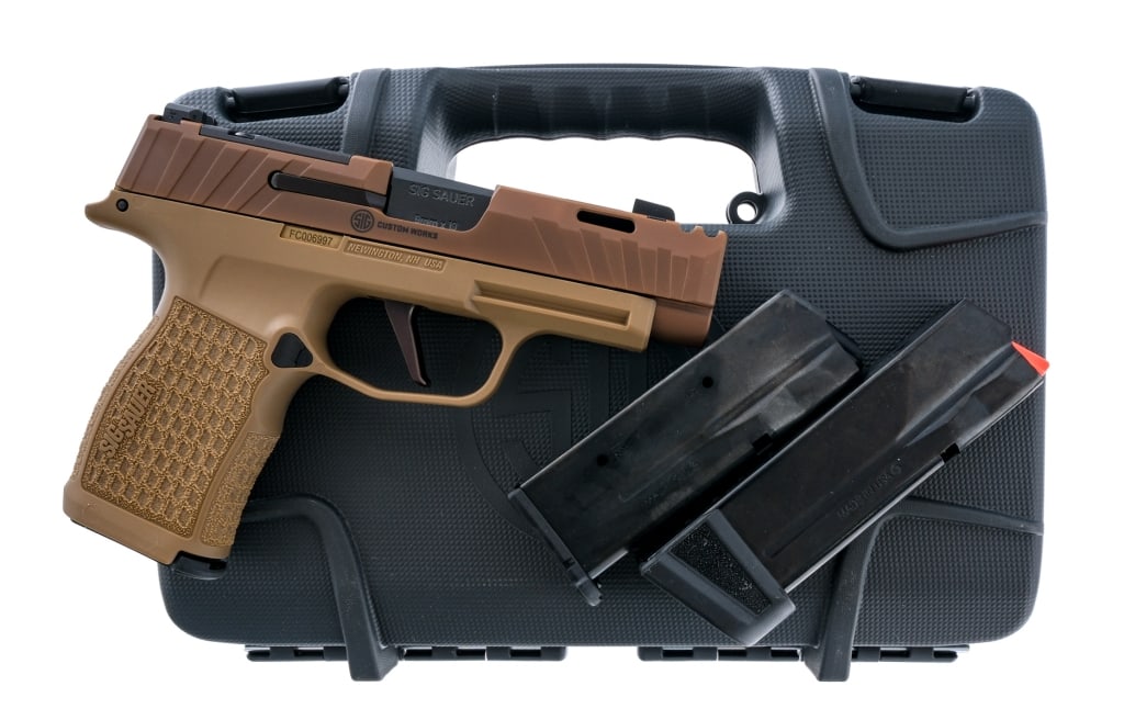 Sig Sauer P365 XL Spectre Comp 9mm Pistol: Description Sig Sauer Custom Works P365 XL Spectre Comp Coyote chambered in 9mm with three magazines and a 3.1" carbon steel barrel. Integrated compensator. Two of the magazines are flush fit and hold