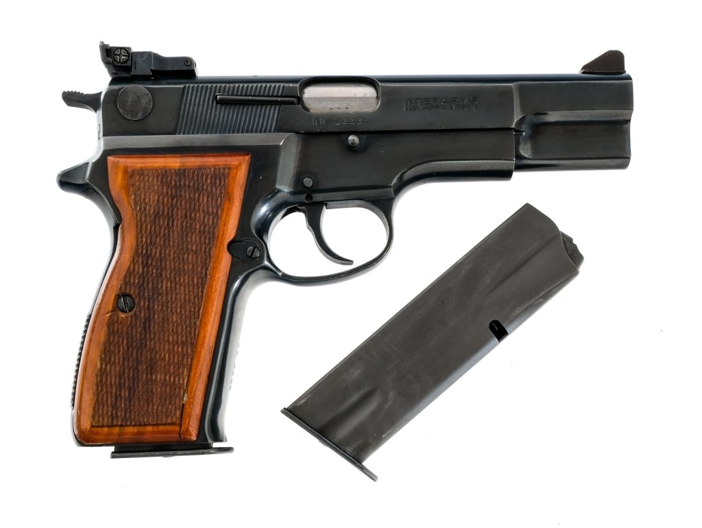 Hungarian Arms Works R-9 9mm Semi Auto Pistol: Description Hungarian Arms Works R-9 chambered in 9mm with two, fourteen round magazines and a 4 3/4"barrel. Manufactured in Hungary and imported by Interarms, marked on the slide. Blued steel frame w