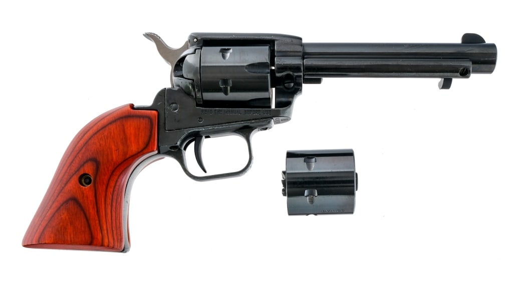 Heritage Rough Rider .22 LR/Mag Revolver: Description Heritage Rough Rider in .22 Long Rifle with a six round capacity and a 5" barrel. Comes with an extra .22 Magnum cylinder. Smooth laminated wood grip plates. Black anodized frame. Blued tr