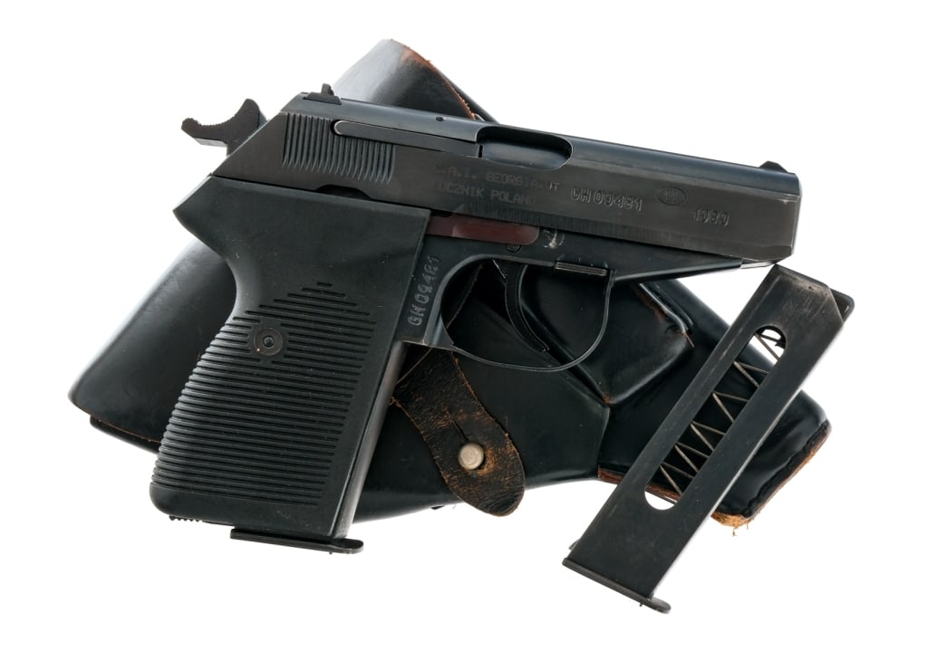 FB Radom P-83 Wanad 9x18mm Semi Auto Pistol: Description FB Radom P-83 Wanad chambered in 9x18mm Makarov with two, eight round magazines and a 3.5" Barrel. Manufactured in Lucznik Poland in 1989. Imported by Century Arms, marked on the right sid