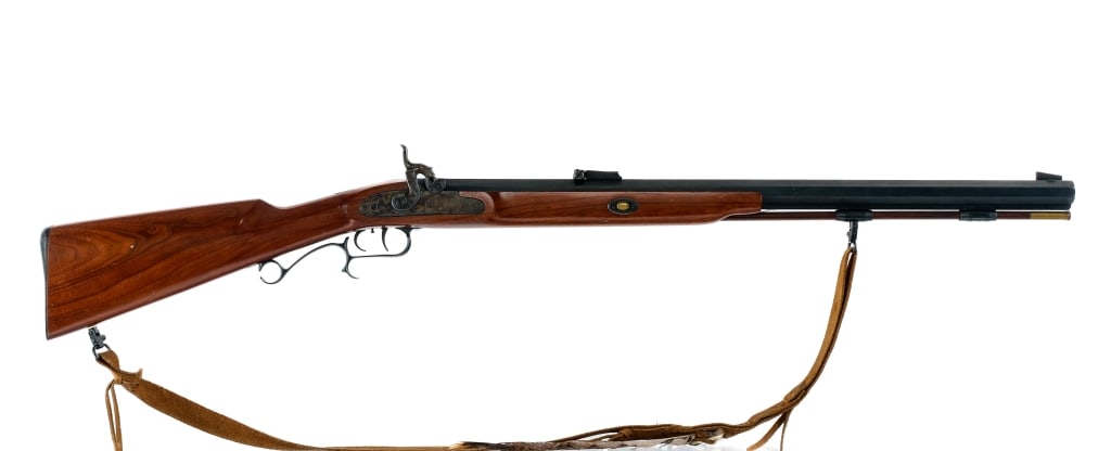 Thompson Center .56 Smooth Bore Single Shot Rifle: Description Thompson Center Arms Smooth Bore rifle in .56 caliber with a single round capacity and a 26" octagon barrel. Blued butt plate. Smooth wood stock and front forend. Blued trigger guard