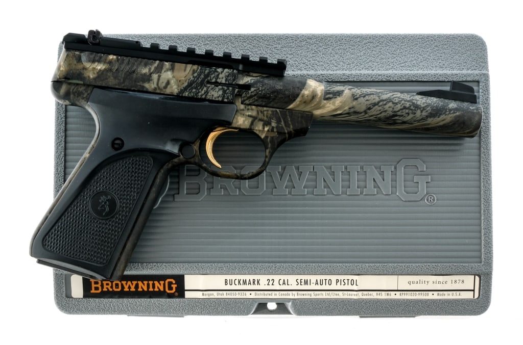 Browning Buck Mark Camo Camper .22 LR Pistol: Description Browning Buck Mark Camo Camper chambered in .22 long rifle with one, ten round magazine and a 5.5" bull barrel. Camo finished alloy frame with checkered polymer grips. Gold plated trigger.