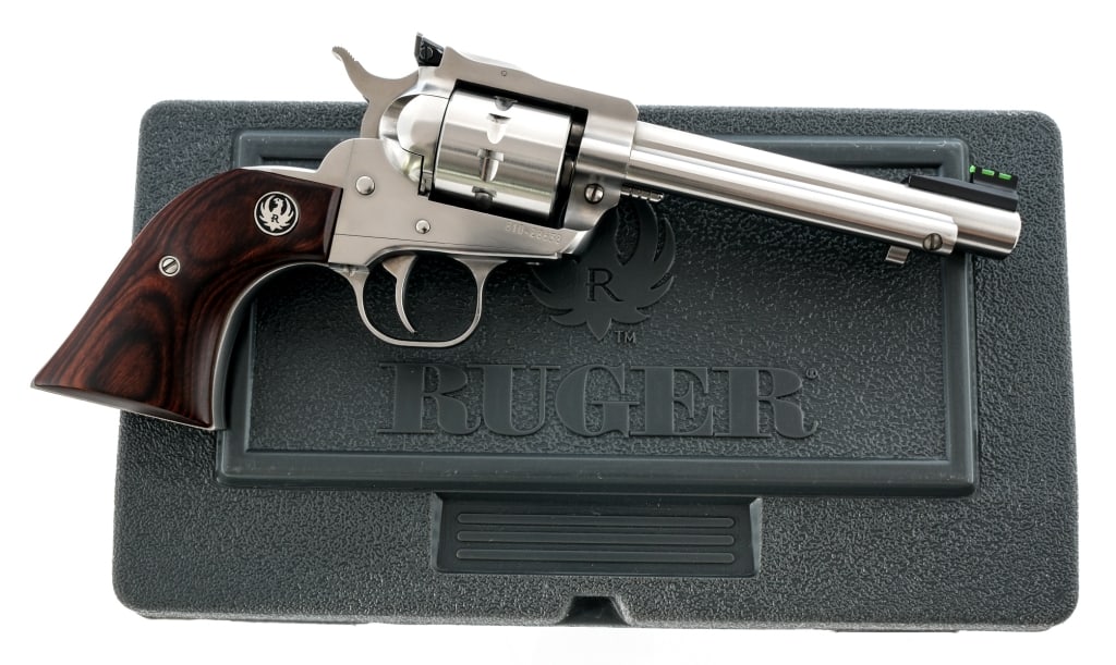 Ruger Single-Ten .22 LR SA Revolver: Description Ruger Single-Ten chambered in .22 long rifle with a ten-round cylinder and a 5.5" barrel. Manufactured in 2018 with serial number 810-28638. Stainless steel finish. Smooth wood grips. Sing
