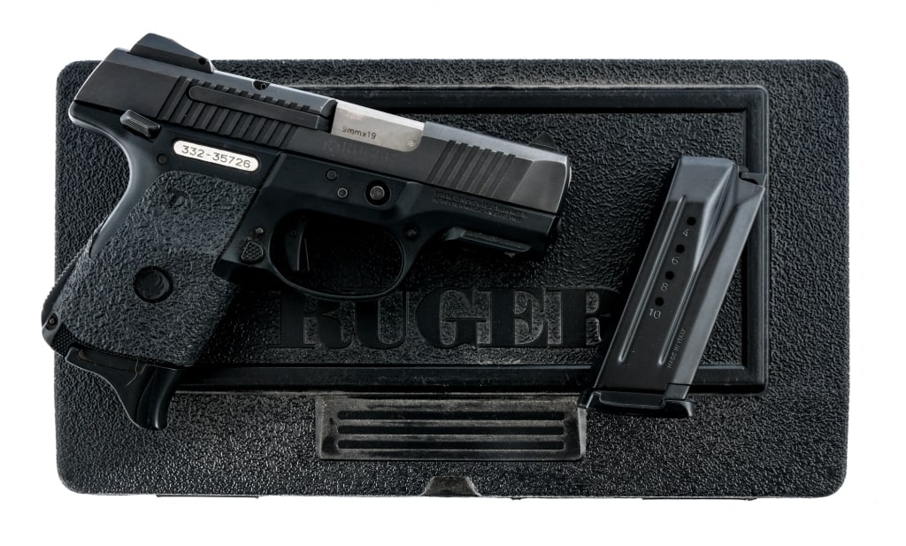 Ruger SR9C 9mm Semi Auto Pistol: Description Ruger SR9C chambered in 9mm with two, ten round magazines and a 3.5" barrel. Manufactured in 2010 with serial number 332-35726. Textured polymer frame with aftermarket grip tape. Polymer t