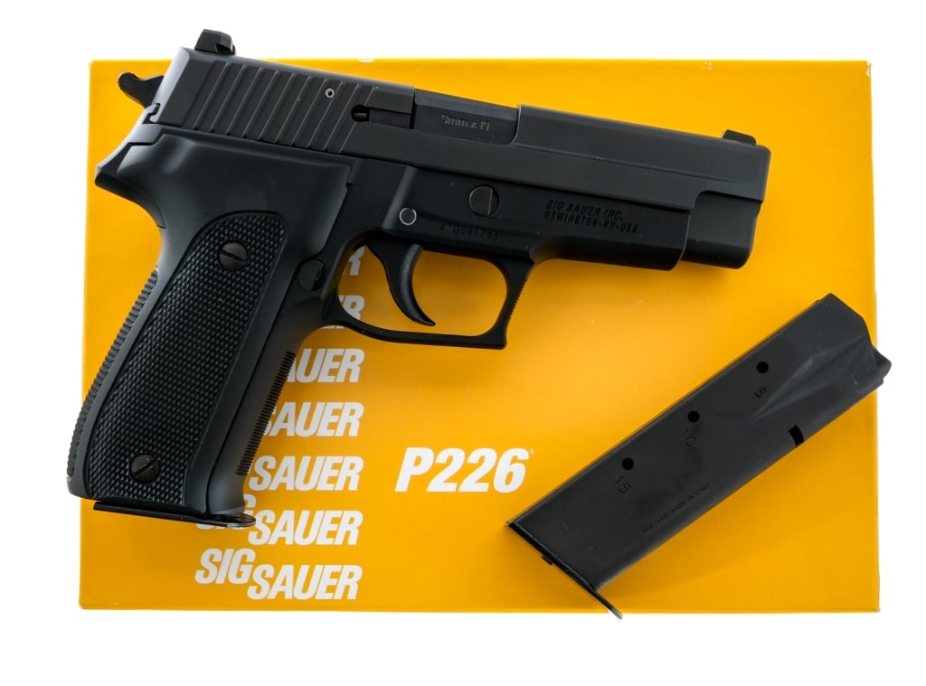 Sig Sauer P226 40th Anniversary 9mm Pistol: Description Sig Sauer P226 40th Anniversary (E26-9-40YR) chambered in 9mm with two, fifteen round magazines and a 4.4" barrel. Black finished aluminum alloy frame with checkered aluminum grips. Double
