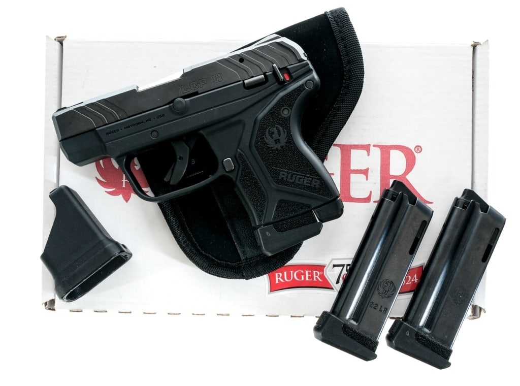 Ruger LCP II .22 LR Semi Auto Pistol: Description Ruger LCP II chambered in .22 Long Rifle with three, ten round magazine and a 2 3/4" barrel. Manufactured in 2021. Textured polymer frame with manual de-cocker. Trigger shoe safety. Black 