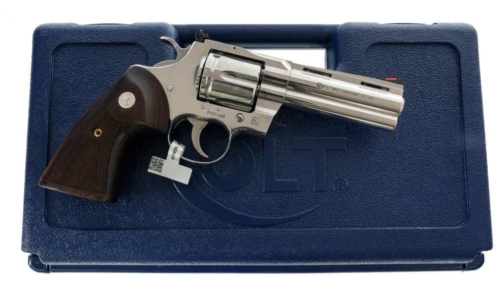 Colt Python .357 Magnum Revolver: Description Colt Python chambered in .357 Magnum with a six-shot cylinder and a 4.25" vented rib barrel. Polished stainless steel construction and finish. Checkered wood grips with Silver Rampant