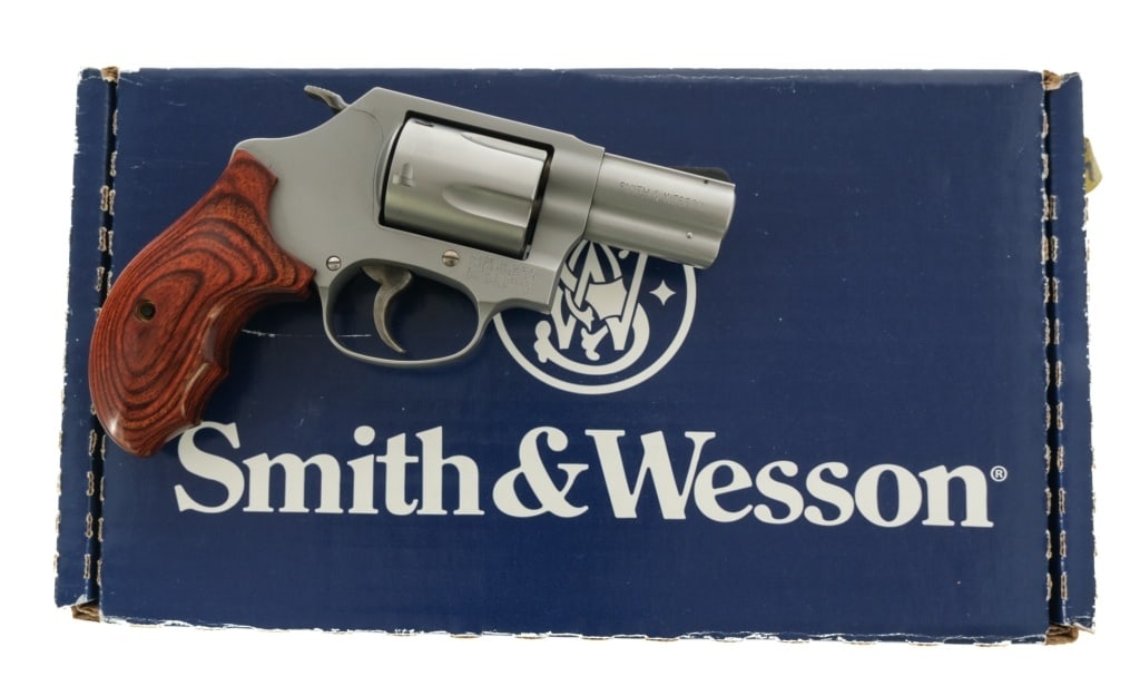 Smith & Wesson 60-14 .357 Magnum Revolver: Description Smith & Wesson 60-14 chambered in .357 Magnum with a five-shot cylinder and a 2.125" snub nose barrel. Stainless steel construction and finish. Case colored trigger and hammer. Smooth wood