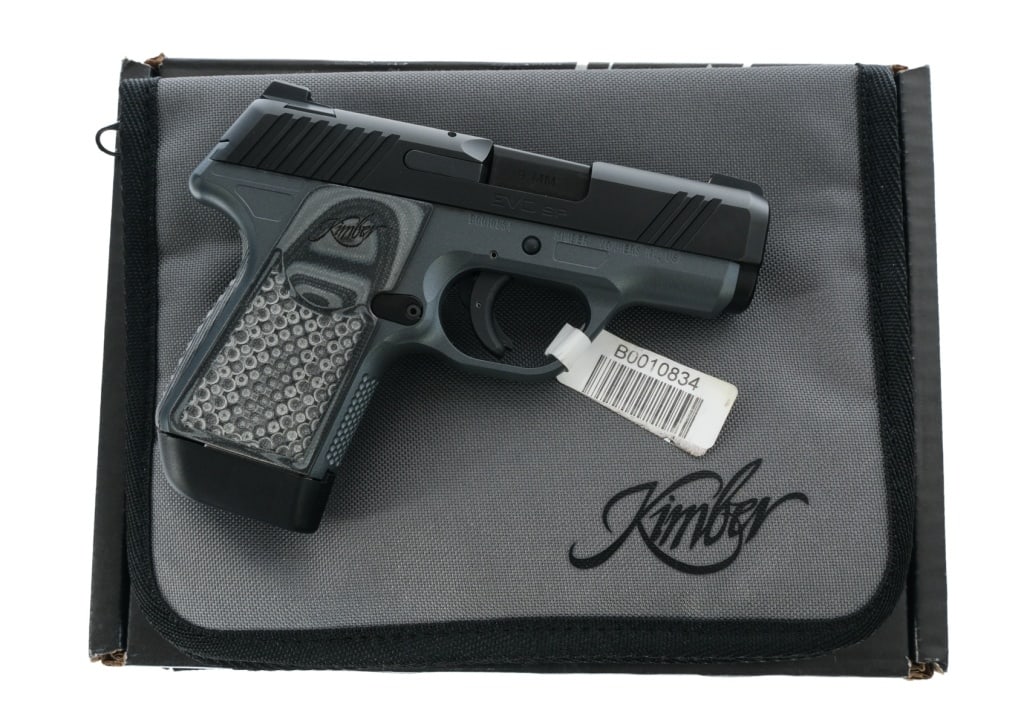 Kimber Evo SP 9mm Semi Auto Pistol: Description Kimber EVO SP Custom Shop chambered in 9mm with one, seven round magazine and a 3.16" stainless steel match-grade barrel with deep crown. Gray finished alloy frame with textured polymer gr