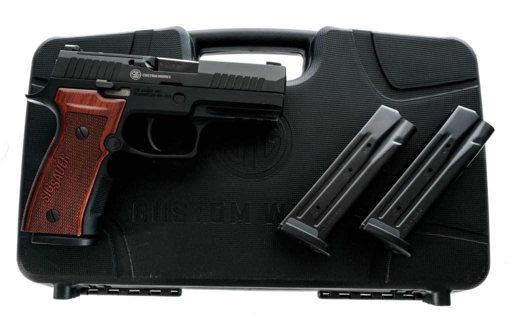 Sig Sauer P320 AXG Classic 9mm Semi Auto Pistol: Description Description Sig Sauer Custom Works P320 AXG Classic chambered in 9mm with three, seventeen round removable magazines and a 3.9" carbon steel barrel. Black hard coat anodized AXG frame with