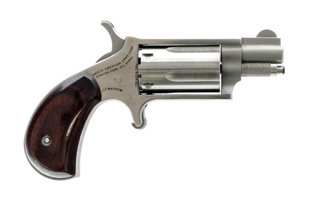 NAA .22 Magnum Mini Revolver: Description North American Arms Mini Revolver chambered in .22 Magnum with a five-shot cylinder and a 1.25" barrel. Stainless steel construction and finish. Single action trigger. Smooth wood grips. R