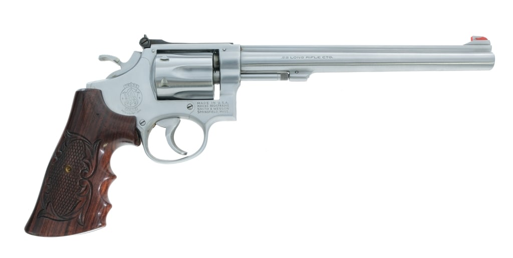 Smith & Wesson 17-3 .22 Long Rifle Revolver: Description Smith & Wesson 17-3 chambered in .22 Long Rifle with a six-shot cylinder and a 8 1/4" barrel. Manufactured in 1975 with serial number 8K62577. Stainless steel finish and construction. Doub