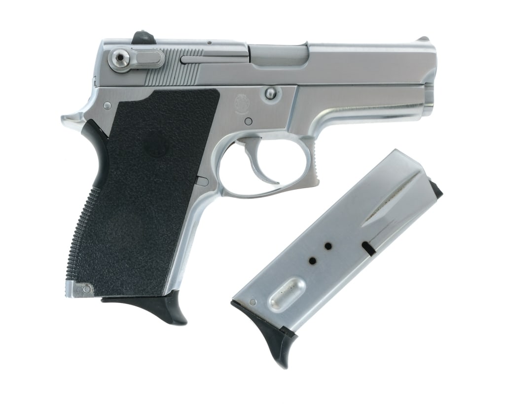 Smith & Wesson 469 9mm Semi Auto Pistol: Description Smith & Wesson 469 chambered in 9mm with two, ten round magazines and a 3.5" barrel. Stainless steel frame with textured polymer grips. Double/single action trigger with bobbed hammer. Sta