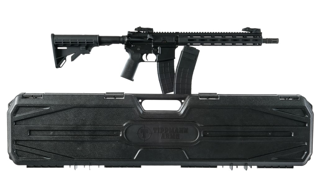 Tippman Arms M4-22 .22 LR Semi Auto Rifle: Description Tippman Arms M4-22 chambered in .22 Long Rifle with two, ten round magazines and a 16" barrel with pinned faux flash hider. 12" MLOK aluminum handguard. Flat top aluminum upper receiver wi