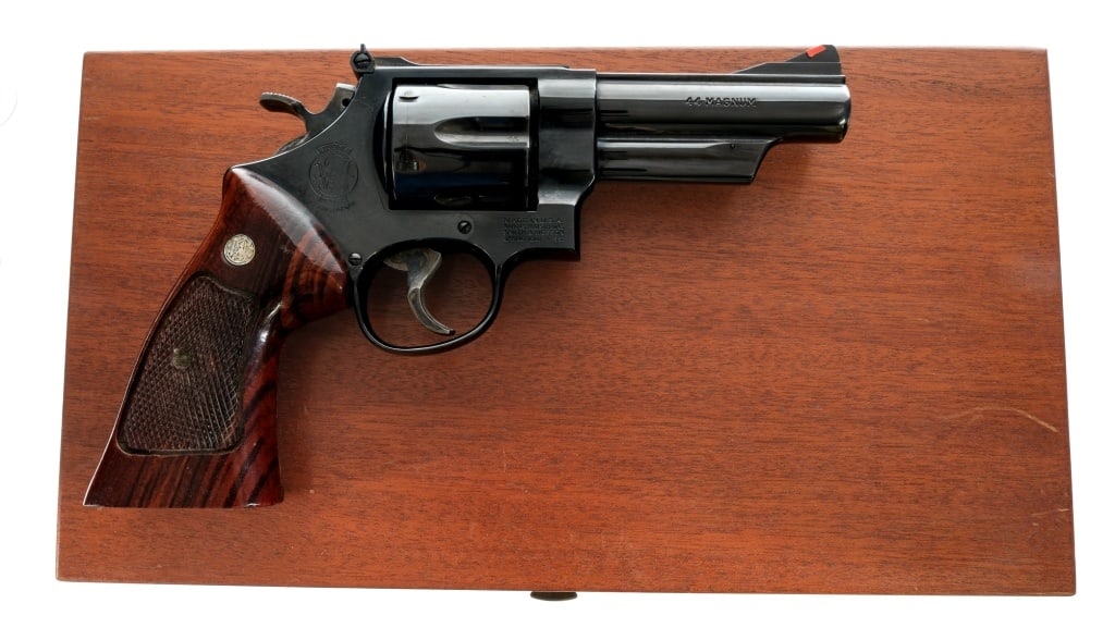 Smith & Wesson 29-3 .44 Mag Revolver: Description Smith & Wesson 29-3 chambered in .44 Remington Magnum with a six-shot cylinder and a 4" barrel. Blued barrel, frame, fluted cylinder and checkered cylinder release. S&W three T's. Case col