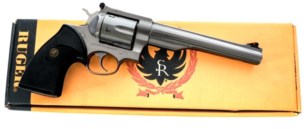 Ruger Redhawk .44 Mag Revolver: Description Ruger Redhawk in .44 Magnum with a six round capacity and a 7.5" barrel. Made in Southport Connecticut in 1982. Checkered Pachmayr rubber grip plates. Polished stainless steel frame, trigg