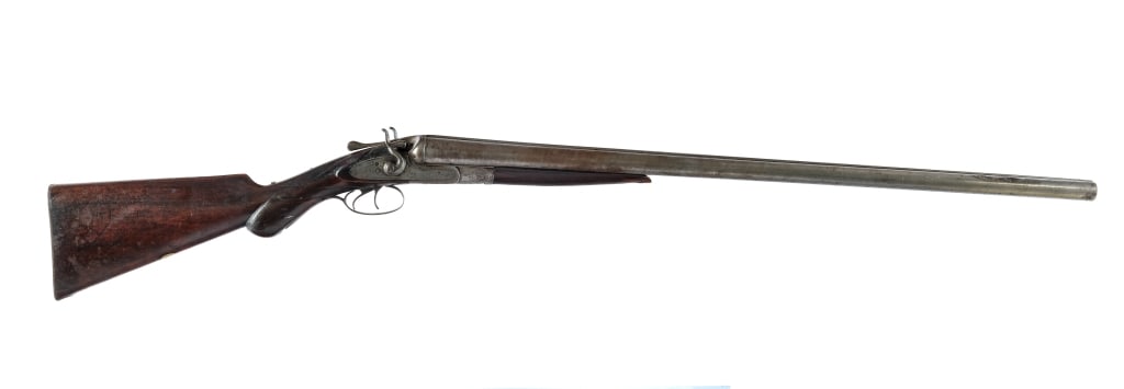 Fred Williams SxS 10 Ga Hammered Shotgun: Description Fred Williams Side by Side Hammered Shotgun chambered in 10 gauge for 2 3/4" shells with 30" Laminated steel barrels. Manufactured between 1904-1924 with serial number 22870. Fixed cylinde
