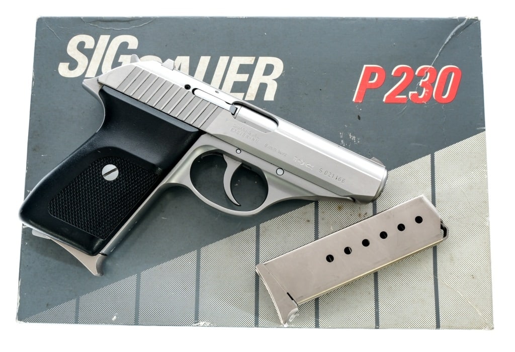 Sig Sauer P230 SL .380 ACP Semi Auto Pistol: Description Sig Sauer P230-SL in .380 ACP with two, seven round removable magazines and a 3.75" barrel. Made in West Germany in 1992. Checkered composite grip. Polished and matte stainless steel frame