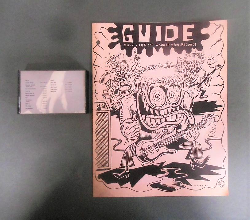 2pc Warner Bros. Record Guide Lot: The August 1985 Guide cassette tape & July 1986 album Guide with Gary Panter designed cover of The Melvin Glugg Experience