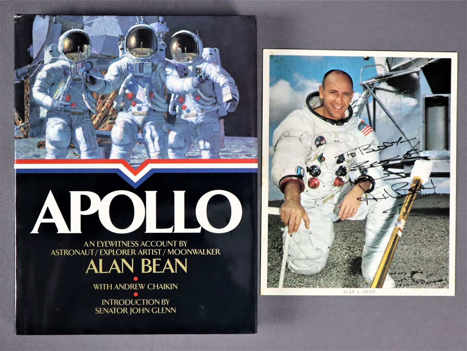 Alan Bean "Apollo" Signed Book & Lithograph: Alan Bean coffee table book titled "Apollo'' that is hand signed and inscribed. It comes with an official NASA issued lithograph that has also been hand signed by Alan Bean. Both are in very good cond