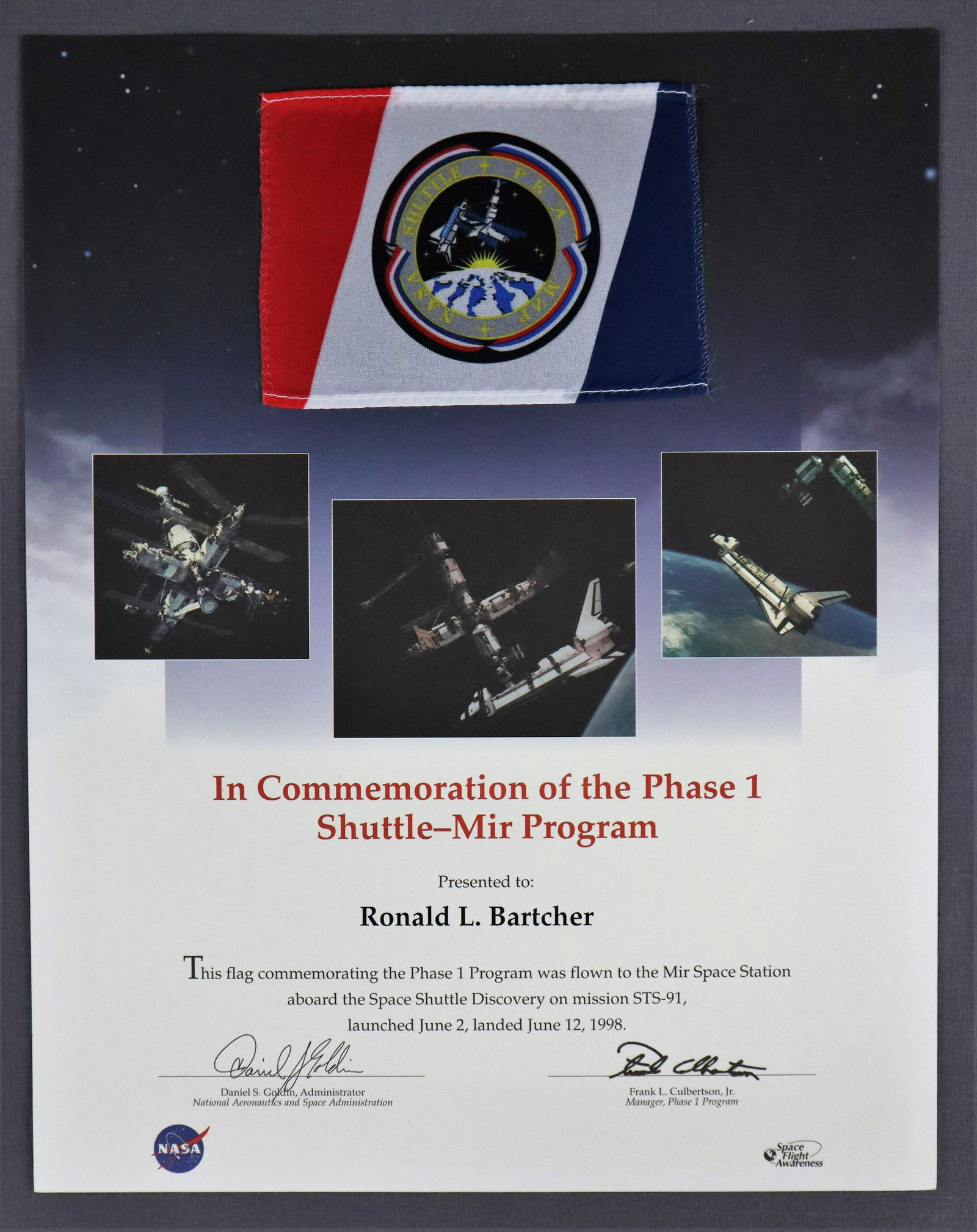 STS-91 Flag Flown to the Russian MIR Space Station (1 of 2)