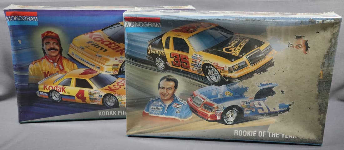 2 - Monogram 1:24 Scale Model Stock Car Kits: This lot consists of two Monogram 1:24 scale model Stock Car kits. There is a 'Rookie of the Year' with 1985 Ford Thunderbirds. These cars are new in the box but the box shows signs of surface damage