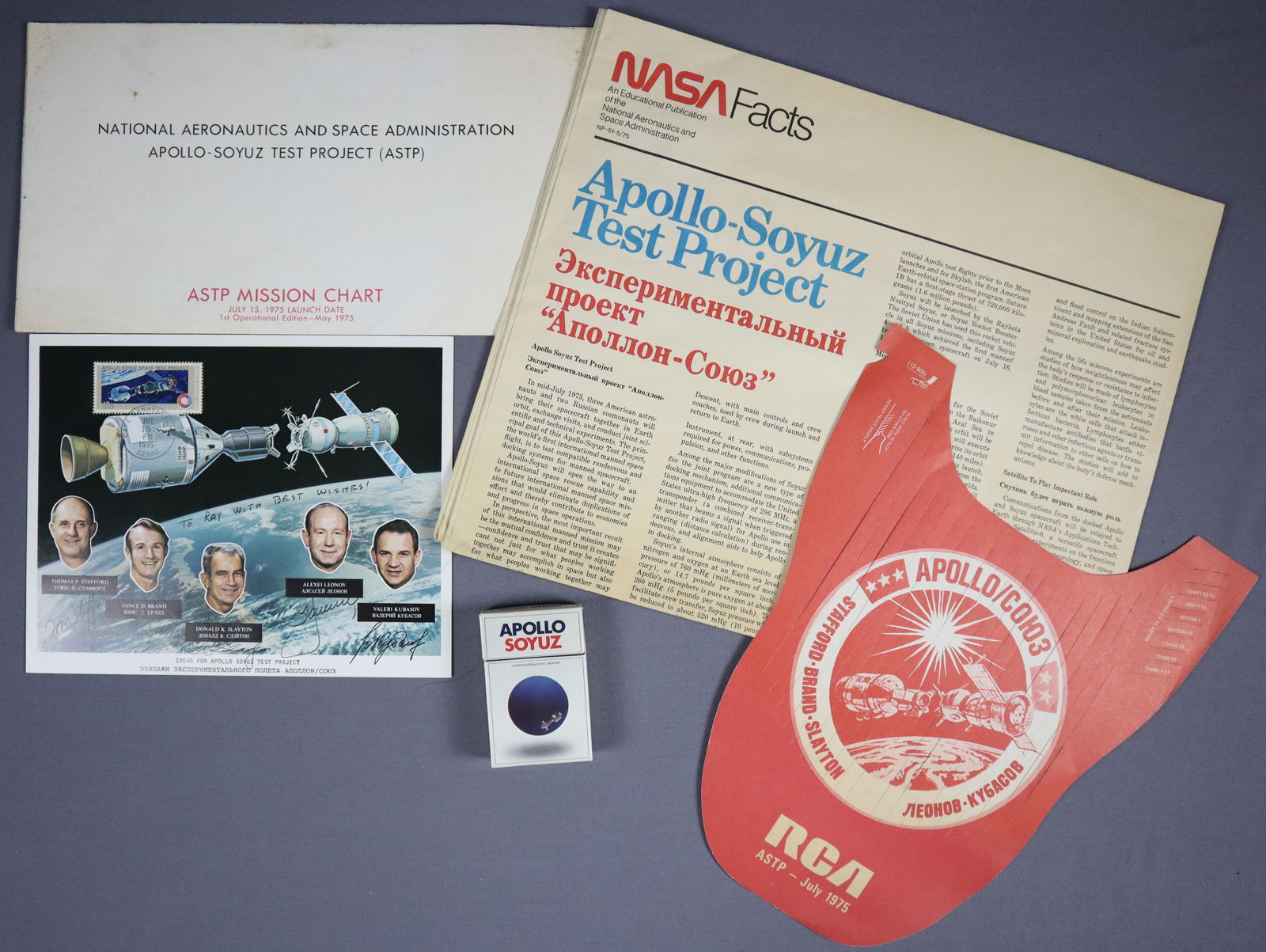 Apollo-Soyuz Crew Signed Collection of Mission Items: This lot starts with a vintage NASA lithograph that has been hand signed by both the American and Russian crews of the ASTP mission. This is also postmarked from KSC on the date of Launch. This lot al