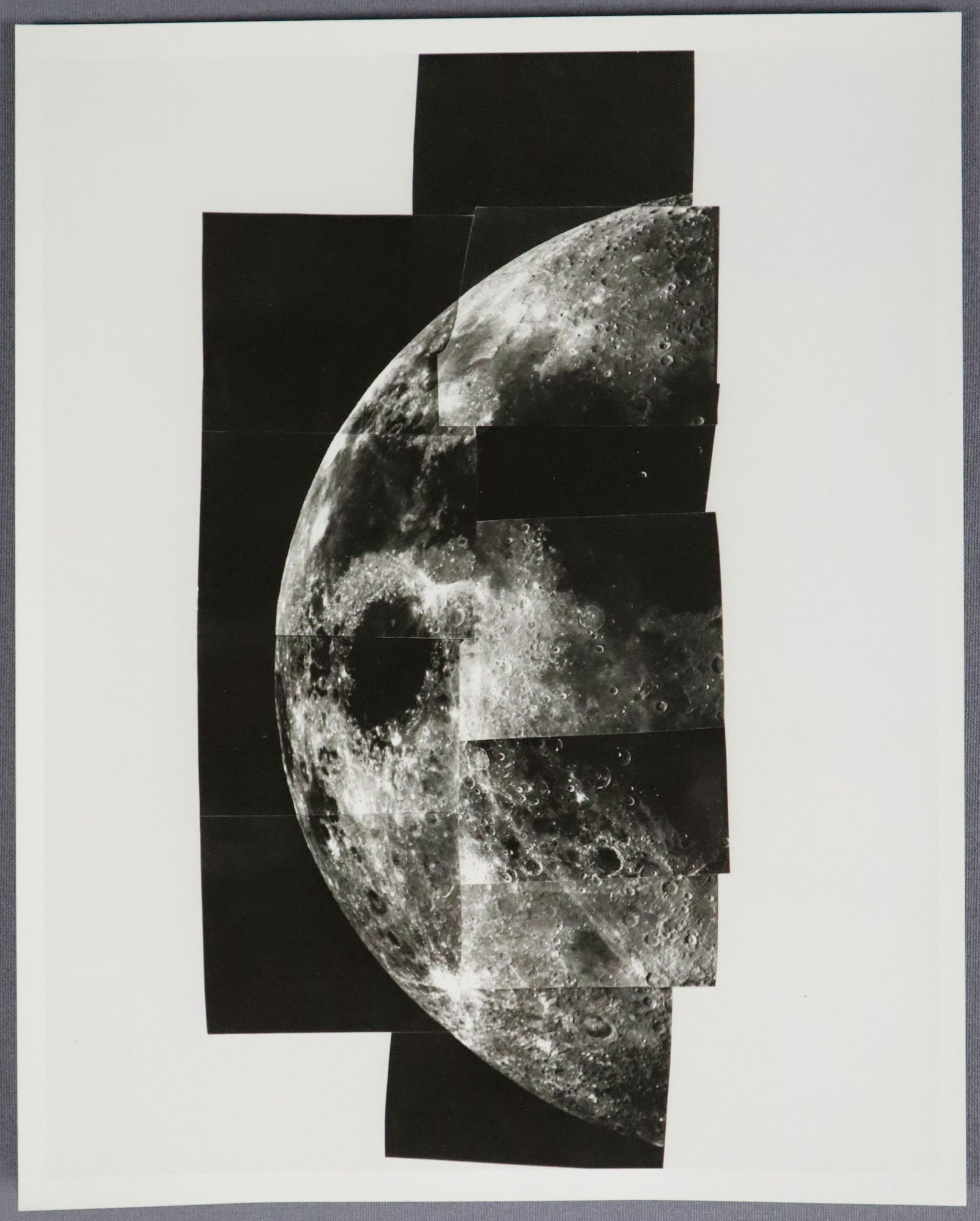 Mariner 10 Mosaic Photograph of the Moon: This is an official NASA released mosaic photograph by Mariner 10 showing an image of the Moon. This photograph is dated November 6, 1973. It is in very good to near mint condition. It measures 8" x 1