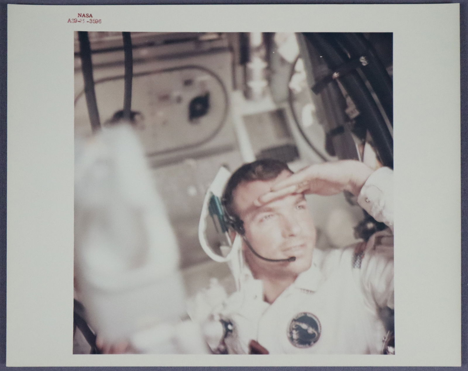 Apollo 9 David Scott Red Numbered Photograph: This is an official NASA red numbered (AS9-23-3596) photograph showing Command Module Pilot David Scott in the Command Module "Gumdrop" Apollo 9, March 1969. This photograph is printed on "A Kodak Pap