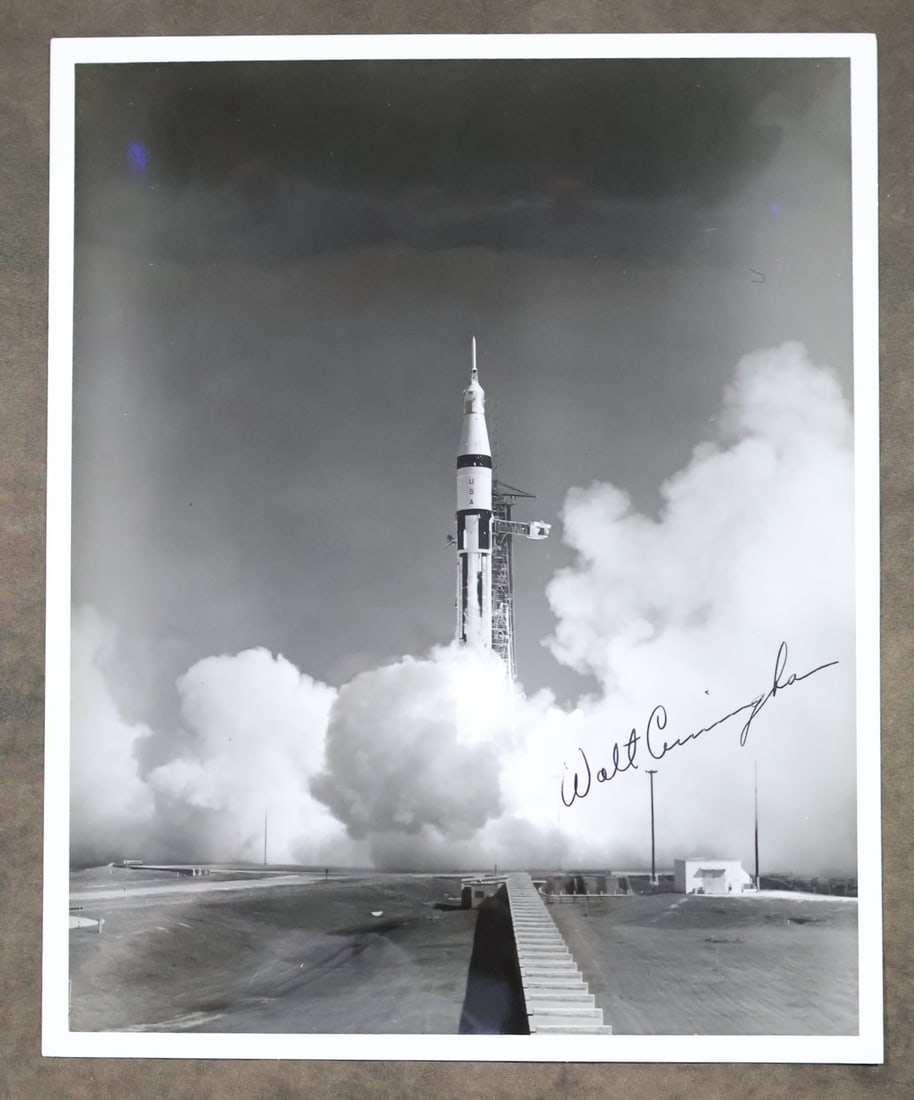 Astronaut Walt Cunningham Signed Apollo 7 Launch Photograph: An official vintage NASA Apollo 7 launch photograph that has been hand signed by Astronaut Walt Cunningham. This 8" x 10" black and white glossy photograph is in very good condition with light edge