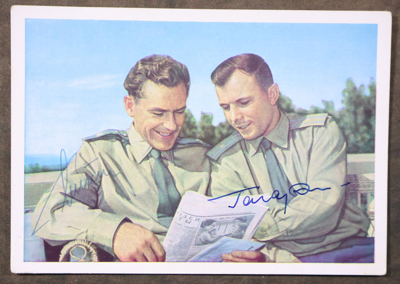 Rare Yuri Gagarin & Gherman Titov Signed Postcard: A rare find of a Russian postcard that has been hand signed by both the first and second Cosmonauts Yuri Gagarin, the first man in space, and Gherman Titov, the second Russian to orbit the Earth and t