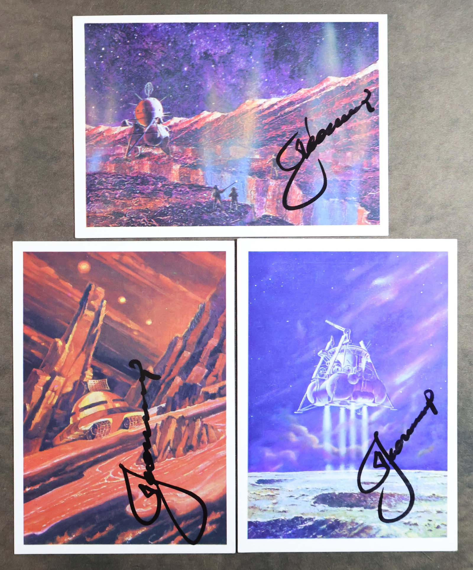 3 - Vintage Soviet Cosmonaut Signed Art Print Postcards: Three vintage Soviet space themed art print postcards, each has been hand signed by a Russian cosmonaut Alexey Leonov. These collectible postcards are in very good condition with minor edge corner