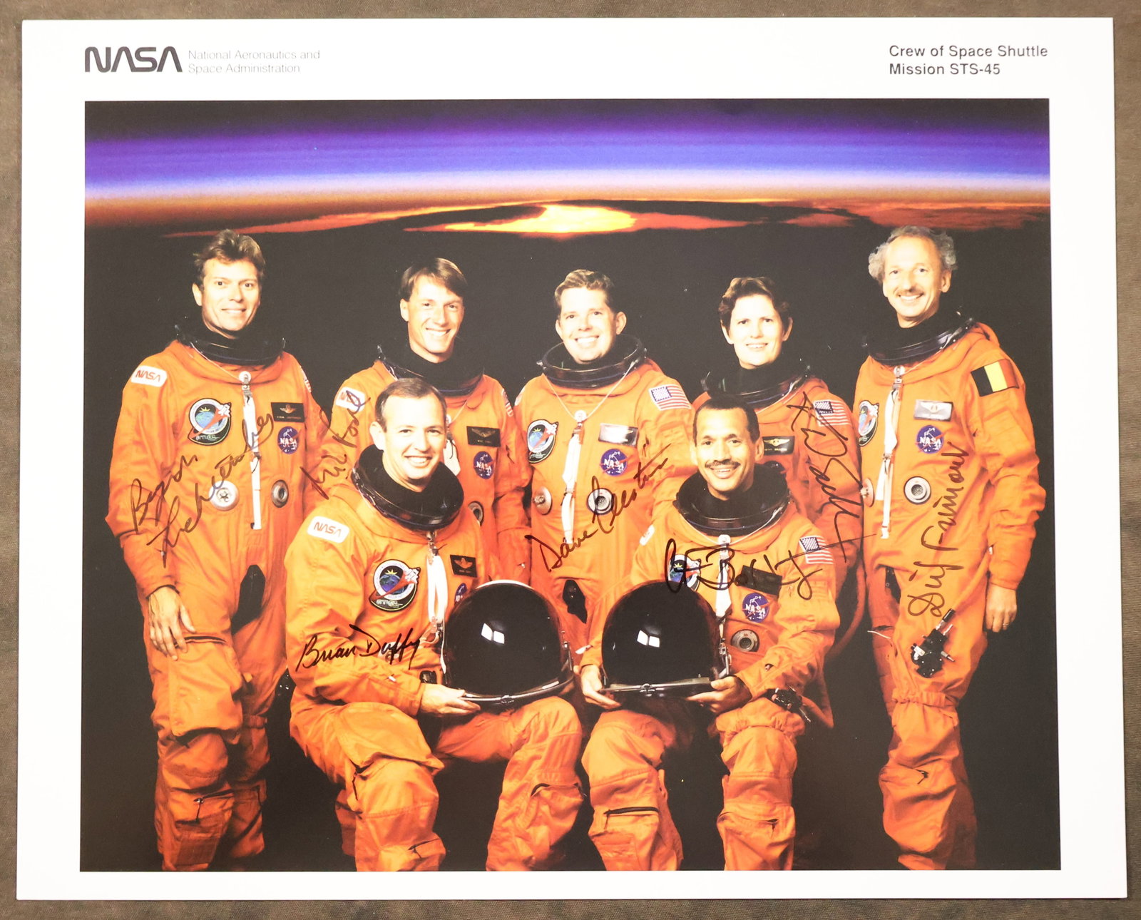 STS-45 Full Crew Signed NASA Lithograph: An official NASA issued lithograph for the STS-45 mission that has been hand signed by the full crew members - astronauts Charles Bolden, Brian Duffy, Kathryn Sullivan, David Leestma, Michael Foale, B