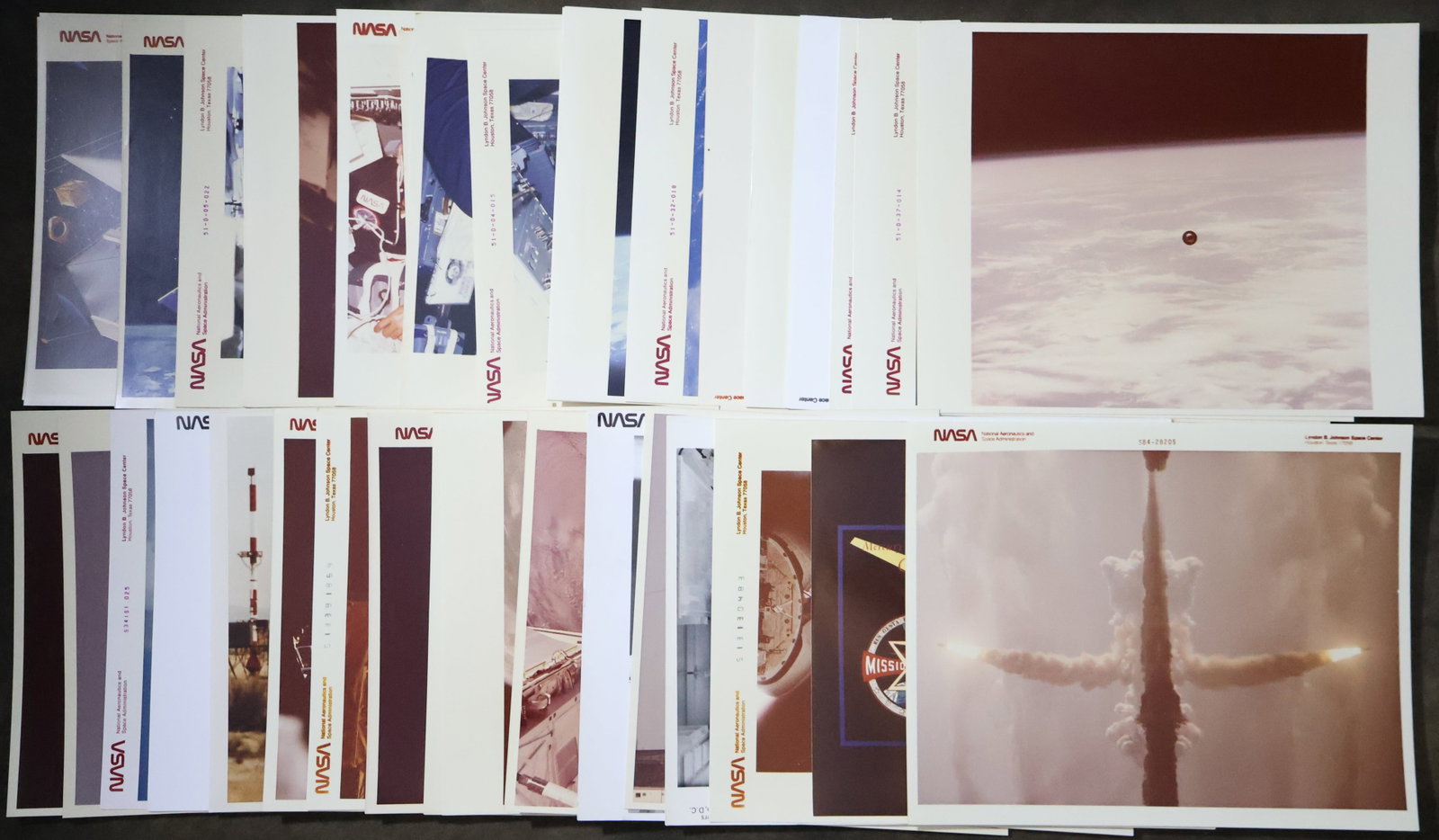 35 - Early NASA Space Shuttle Mission Photographs: A very nice collection of thirty five NASA images covering mostly the STS-51 missions with a few other missions included. A large number of these 8" x 10" photographs are official NASA red numbered.