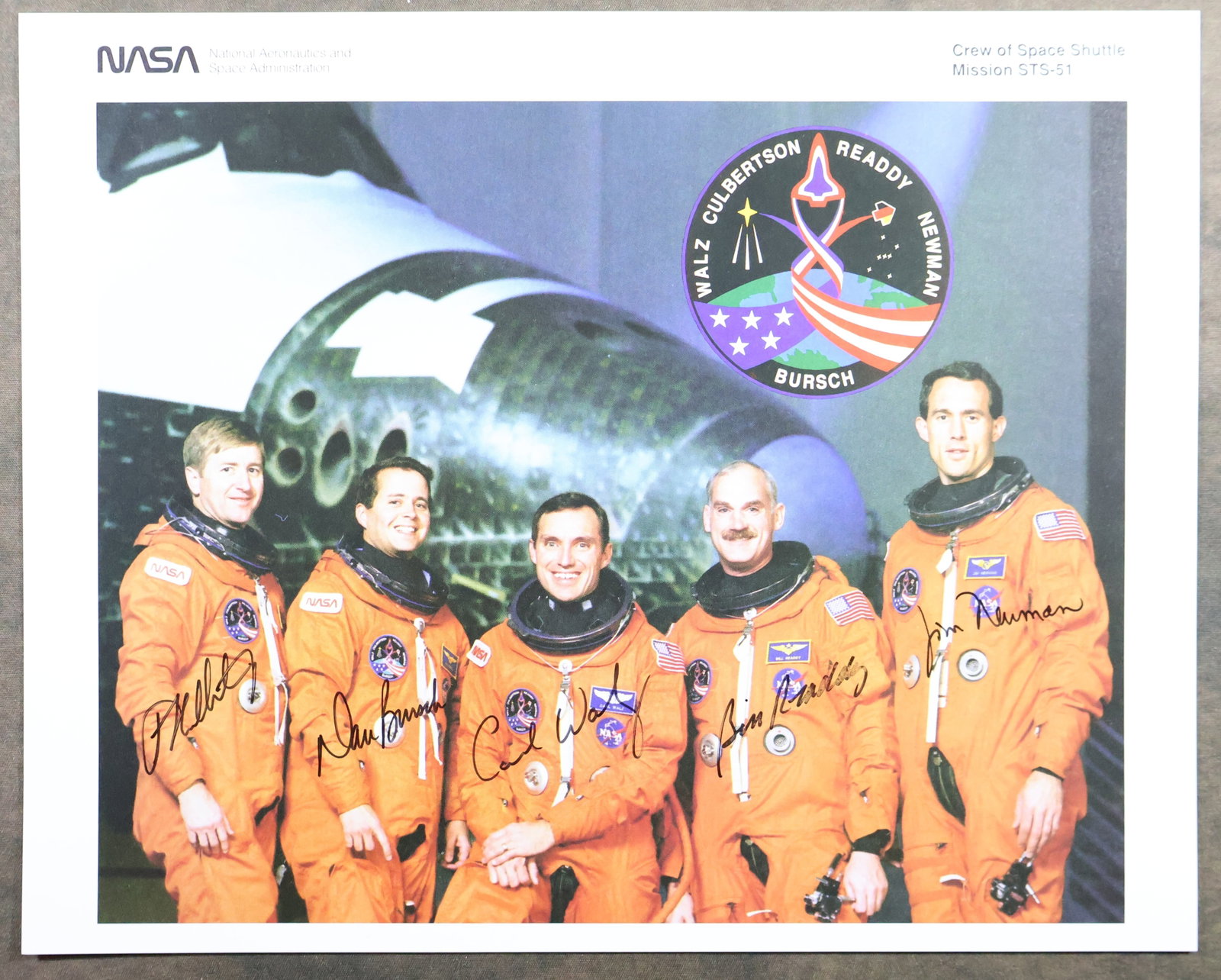 STS-51 Original Crew Signed NASA Lithograph: An official NASA issued lithograph for the STS-51 mission. This 8" x 10" lithograph has been hand signed by the full crew members. It is in near mint condition with minimal handling wear and is